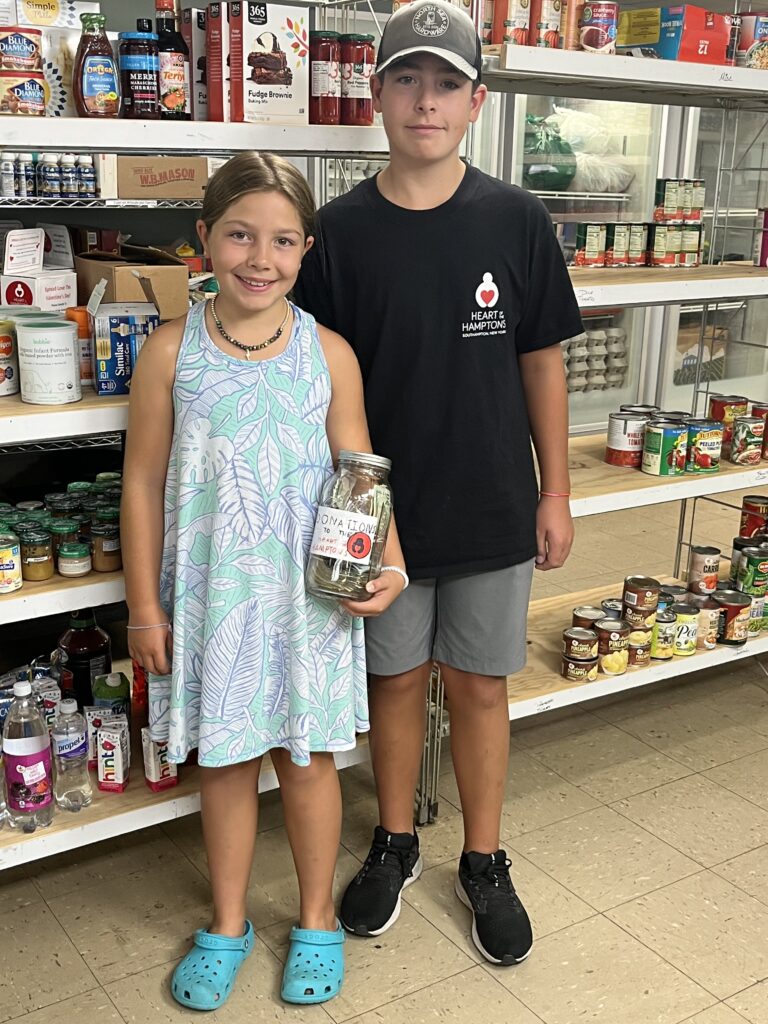 A boy and a girl standing in a store