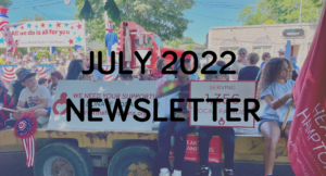 A community parade with people on a decorated float featuring banners, observed by onlookers, with a digital overlay of "july 2022 newsletter".
