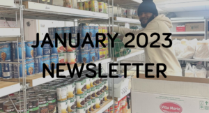 Volunteer stocking shelves at a food pantry for the january 2023 newsletter.